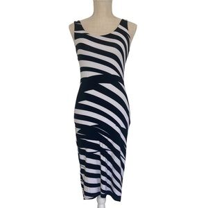 Fully lined size small Bebe black and white stretchy midi dress